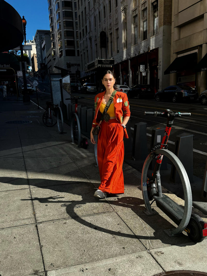 ADITI IN ORANGE IS AN ISLAND TROUSER SET