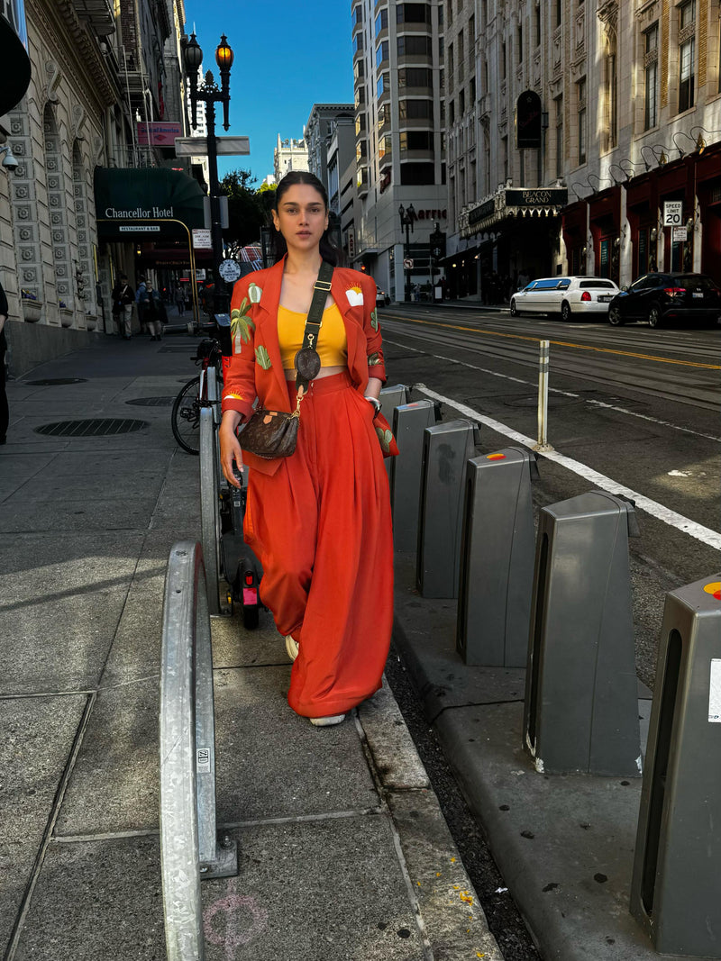 ADITI IN ORANGE IS AN ISLAND TROUSER SET